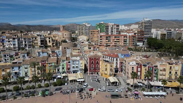 Drone footage coastline and La Vila Joiosa touristic town view from top, sandy beach and Mediterranean seascape.Costa Blanca, Spain.