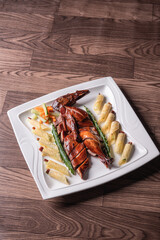 Beijing roasted whole big pipa bbq duck with crepe skin roll and vegetables on wood table background asian Chinese halal banquet meat menu 