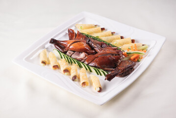 Beijing roasted whole big pipa bbq duck with crepe skin roll and vegetables on wood table background asian Chinese halal banquet meat menu 