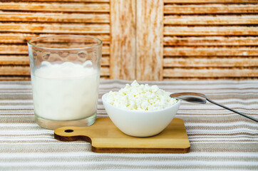 glass of milk, cup of fresh cottage cheese. Fresh farm dairy products, simple rustic still life