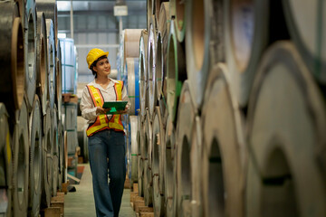 A new generation of engineers in a metal sheet factory.  Studying work methods from supervisors or colleagues and studying by yourself  be taught professionally