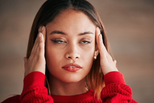 Headache, annoyed and business woman face feeling bored and frustrated from work. Employee, young female and migraine of a worker with a head massage and eye roll with blurred background and stress