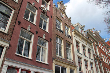 Fototapeta na wymiar old houses at geldersekade in amsterdam in netherlands