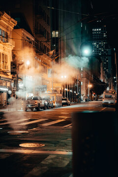 Night Photography of San Francisco Streets with streetlights and fog. USA. Blue and Orange Lights. Traffic.