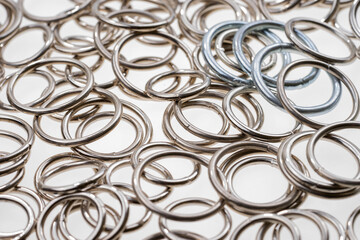 Many metal rings on a light background