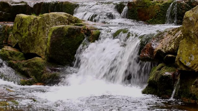Mountain waterfalls with the rocks in the forest, slow motion, close up, hd. ProRes 422 HQ.