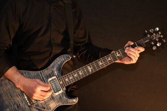 Artist with a PRS Custom 24 electric guitar