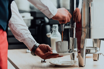 The waiter preparing coffee for hotel guests. Close up photo of service in modern hotels