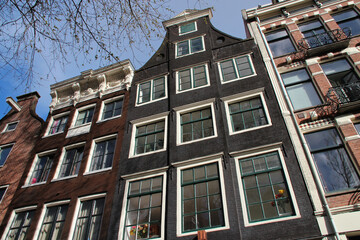 Fototapeta na wymiar old brick houses in amsterdam in netherlands