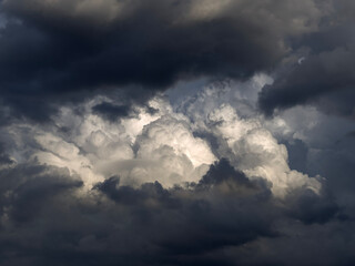 The dark and dramatic background of the storm clouds area.