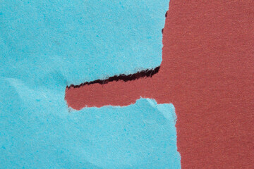 Blue torn paper background with copy space for text. Ripped paper on a red background.	