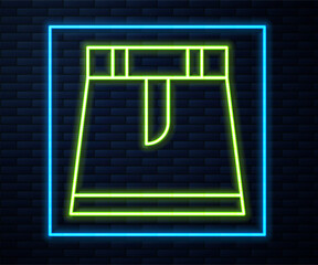 Glowing neon line Skirt icon isolated on brick wall background. Vector