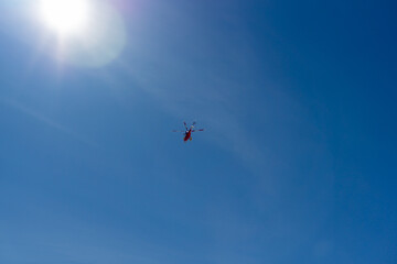 a rescue helicopter flying in the sky