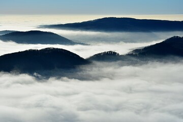 View of the Czech Central Highlands during the inversion. Hills emerging from the mist. Czech...