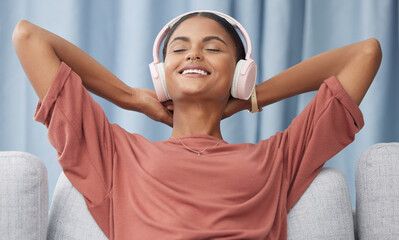 Relax, headphones and woman on a living room sofa feeling peace from music. Web radio, home and...
