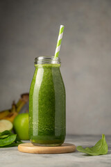 Bottle of green apple and banana smoothie, detox smoothie shake drink