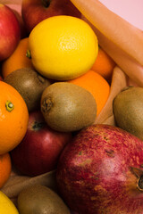 Various fruits in a reusable bag close-up. Earth day and zero waste concept.