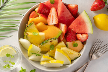 Fototapeta na wymiar Summer fruits assortment platter antipasti, watermelon, pineapple, melon and strawberries. 