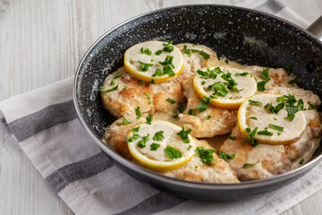 Homemade Creamy Lemon Chicken in a Pan, side view.