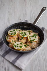 Homemade Creamy Lemon Chicken in a Pan, side view.