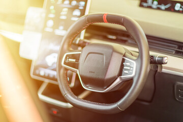close up of steering wheel, modern car interior details	