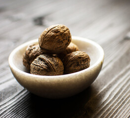 nutmeg in a wooden bowl