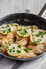 Homemade Creamy Lemon Chicken in a Pan, side view.