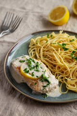 Homemade Creamy Lemon Chicken in a Pan, side view.