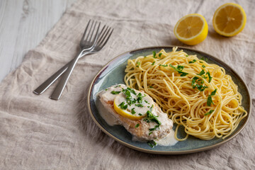 Homemade Creamy Lemon Chicken in a Pan, side view.