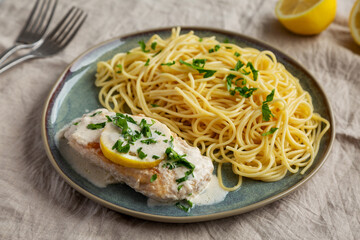 Homemade Creamy Lemon Chicken in a Pan, side view.