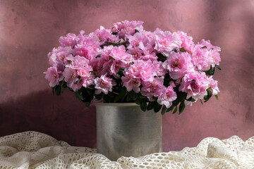 Blooming azalea in aluminum bucket, beautiful pink color flower, seasoning gardening concept