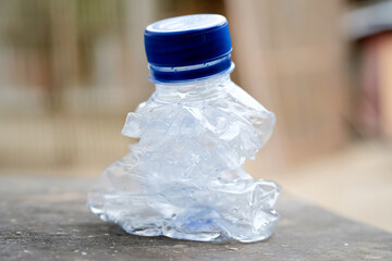 Crumpled plastic bottle trash. Environmental pollution
