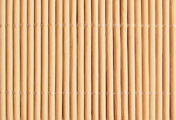 Light brown asian bamboo reed mat texture as background