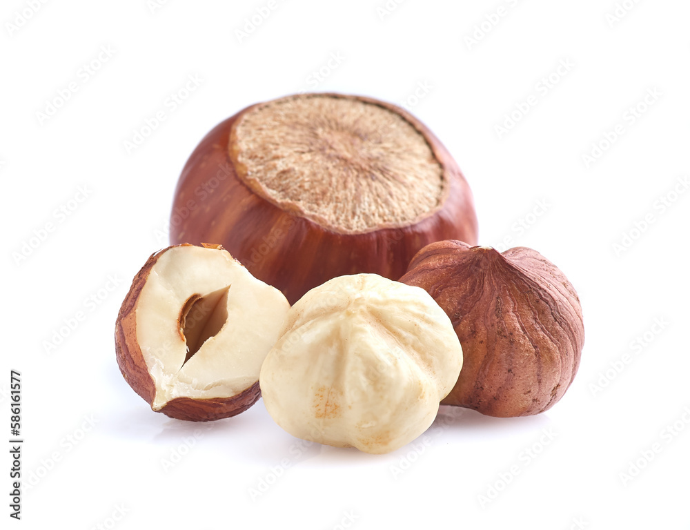 Poster Hazelnuts in closeup on white background