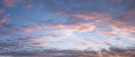 panorama sunset sky with soft pink and grey clouds