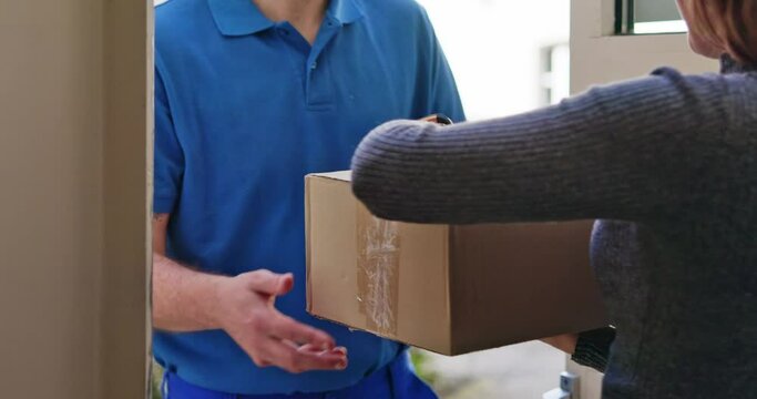 Happy Young Woman Accepting Parcel Box