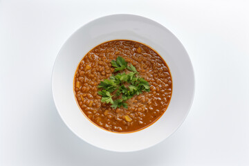 A bowl of tomato soup with a green leaf on top, gen art