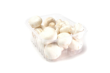 Fresh raw champignon mushrooms in package on isolated white background.