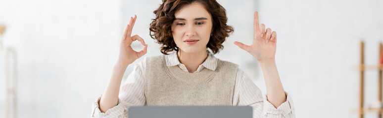 curly sign language teacher showing alphabet letters with hands during online lesson, banner.