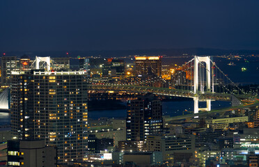 Tokyo night scene. The Rainbow Bridge over Tokyo bay at night. Minato city. Tokyo. Japan