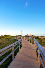 Fototapeta premium Wooden bridge to sightseeing place on Algarve coast outside Lagos, Portugal. Portuguese beaches and shores of the city of Lagos. 