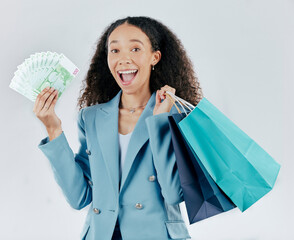 Happy woman, portrait and shopping bags with money winning sale or discount against white studio...