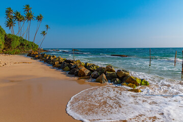 a narrow street of the old town of Galle, Sri Lanka © dudlajzov