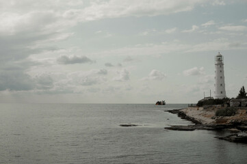 beautiful white lighthouse on the seashore