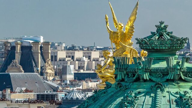 Top view of Palais or Opera Garnier The National Academy of Music with golden statues timelapse in Paris, France. Aerial view from rooftop at sunny summer day.