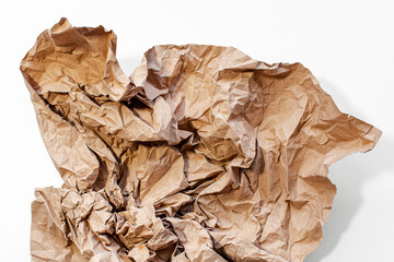 Crumpled paper of beige color isolated on white background.