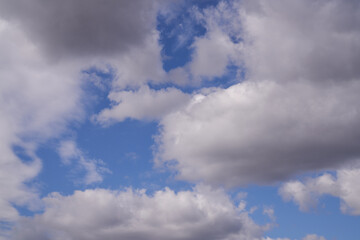 blue sky with dark clouds