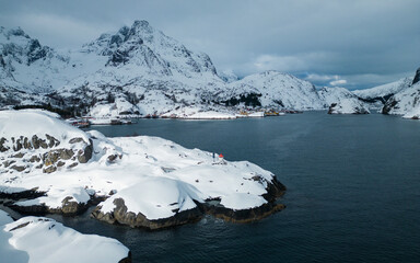 Fototapeta na wymiar Aerial landscape photography. Sunny winter view of Nusfjord town, Norway, Europe. Bright morning scene of Lofoten Islands. Norwegian seascape. View from flying drone. Life over polar circle.