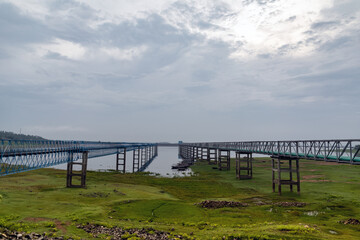 Dam in Mukutmanipur, West Bengal with a beautiful landscape in the background. Cloudy day.