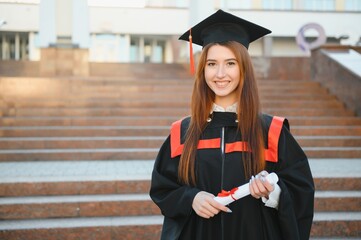 Portrait happy woman on her graduation day University. Education and people.